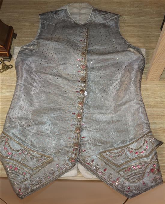 An 18th century gentlemans silver brocade and gold thread embroidered waistcoat